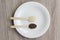 Topview white sesame and perilla frutescens seed for healthy on wooden spoon on white dish on wooden table