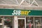 tor, canada - July 22, 2023: subway sandwiches store restaurant front entrance with logo above, neon open. p