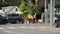 Tor, Canada - July 31, 2023: construction workers dressed in orange with x on their shirts tops with a police