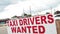 tor, canada - July 31, 2023: taxi drivers wanted sign in red capital letters writing text with cars vehicles...