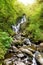 Torc Waterfall, one of most well known tourist attractions in Ireland, located in scenic woodland of Killarney National Park.