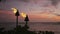 Torch fire flames in Waikiki beach Hawaii sunset