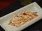 Torched Salmon Aburi Saikyo Sushi with sweet sauce on white plate, Japanese food