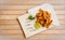 Tori kawa no karaage - japanese style deep fried chicken skin with salt and lime on wooden background , stock photo