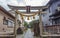 Torii gate with sacred rope at local shrine, Kanazawa, Japan. TRANSLATION OF TEXT: Jikihachiman Shrine