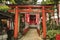 Torii gate of small Shinto Shozoku Inari Shrine dedicated to the Uga-no-Mita