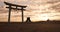 Torii gate, sunset sky in Japan and clouds with zen, spiritual history and travel adventure. Shinto architecture, Asian