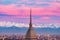 Torino Turin, Italy: cityscape at sunrise with details of the Mole Antonelliana towering over the city. Scenic colorful light on