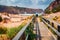 Torists walking to Cala Domestica beach. Windy summer scene of Sardinia, Italy, Europe.