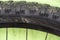 torn bicycle tire. Bicycle repair in the workshop. Replacing the tube on the wheel of a mountain bike. Rupture close up. The rim