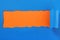 Torn blue paper center strip orange background untidy edge