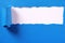 Torn blue paper strip headline white background frame