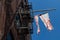 Torn and Faded American Flag Hanging Outside an Old New York City Apartment Building