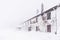 Torn house covered in snow - horizontal