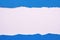 Torn paper blue strip untidy edge white frame background