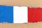 Torn paper with National Flag of France. Travel concept with French Flag