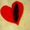 Torn red heart on fabric background. Valentines Day.