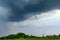 Tornado atmospheric whirlwind in a cumulonimbus thundercloud