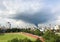 A tornado-like rain cloud covered cities and football fields