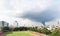 A tornado-like rain cloud covered cities and football fields