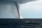 A tornado made of water over the ocean created with generative AI technology