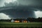 Tornado touching down with lighting strikes and severe weather in a big field