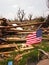 Tornado wreckage with American flag