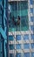 TORONTO, CANADA - 06 16 2016: Industrial climber cleaning the glassy wall of Canadian Broadcasting Centre building in