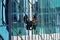 TORONTO, CANADA - 06 16 2016: Industrial climber cleaning the glassy wall of Canadian Broadcasting Centre building in