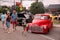 TORONTO, CANADA - 08 18 2018: Visitors of the open air auto show `Wheels on the Danforth` beside gorgeous oldtimer car -