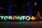 TORONTO, CANADA - 2018-01-01: Night view across the brightly illuminated for New Year eve skating rink with TORONTO sign