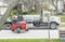 Toronto, Canada - April 28, 2020: Workman Driving a Red Forklift to Move a Pile of Concrete Patio Stones on a Suburban Street #4