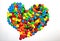 TORONTO, CANADA - March 10, 2017: A heart-shaped pile of colorful coated chocolates M&M