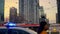 Toronto, Canada - May 6, 2023: busy metropolis with hurrying people and police patrol car. Police car with flashing