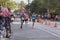 TORONTO, ON/CANADA - OCT 22, 2017: A marathon runner with remembering Ed sign passes the 33km turnaround point and gives