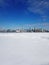 Toronto city skyline seen from toronto Islands over frozen lake Ontario