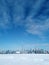 Toronto city skyline seen from toronto Islands over frozen lake Ontario