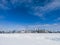 Toronto city skyline seen from toronto Islands over frozen lake Ontario