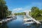 Toronto island Marina with blue sky , green trees and clouds