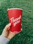 Toronto, Ontario, Canada - September 12, 2020: Thank you phrase on coffee cup from Canadian Tim Hortons restaurant chain. Thanks