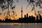 Toronto Sunset Silhouette with canoeists in the water