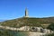 Torre de Hercules or Tower of Hercules with beach and blue sky. A CoruÃ±a, Galicia, Spain.