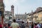 Torre dei Lamberti in piazza delle Erbe in Verona with tourists.