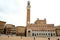 Torre del Mangia and town hall. The building and the Piazza del Campo di Siena are built with Tuscan terracotta bricks