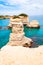 Torre Sant Andrea beach with its soft calcareous rocks and cliffs, sea stacks, small coves and the jagged coast landscape. Crystal