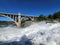 Torrential Lower Spokane Falls after heavy rains on sunny summer morning.