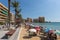 Torrevieja Spain with a busy beach and people with umbrellas and parasols