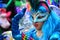 TORREVIEJA, SPAIN FEBRUARY 12, 2023: Close up portrait of a girl in a colorful carnival costume at a festive parade, Alicante