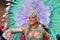 TORREVIEJA, SPAIN FEBRUARY 12, 2023: Woman in feather costume at a Mardi Gras carnival parade, Alicante, Costa blanca region