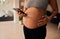 Torso of Pregnant Caucasian female standing, holding cellphone and texting. Healthy lifestyle in modern home in the